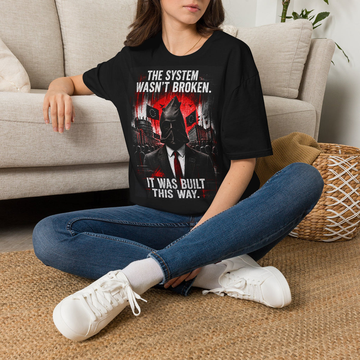 T-Shirt — “The System Wasn’t Broken. It Was Built This Way.” Graphic Tee